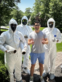 a group of men in protective suits